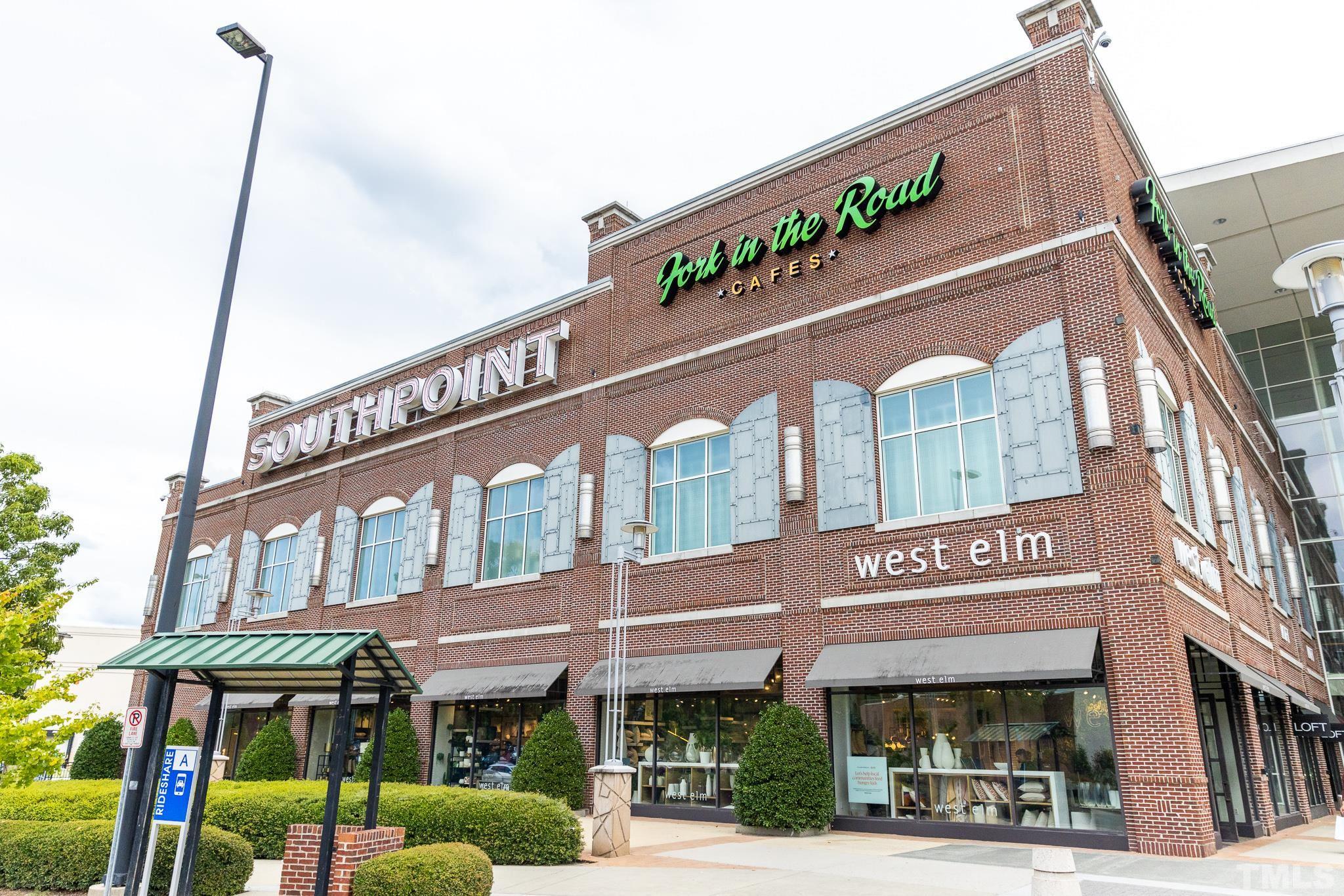 4009 Southpoint Landing Way, Unit 5 Durham, NC 27707 - Photo 41 of 43 a front view of multi story building with retail shops