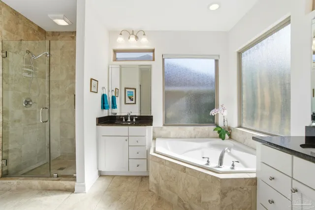 a bedroom with bed and a window