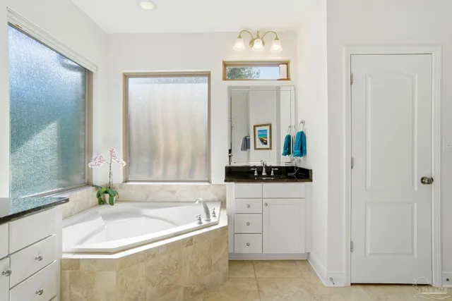 a bathroom with a sink a mirror and a toilet