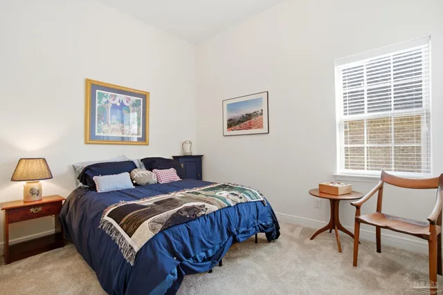 a view of a livingroom with workspace and a couch