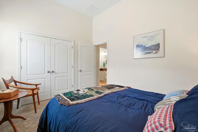 a living room with fireplace furniture and a large window