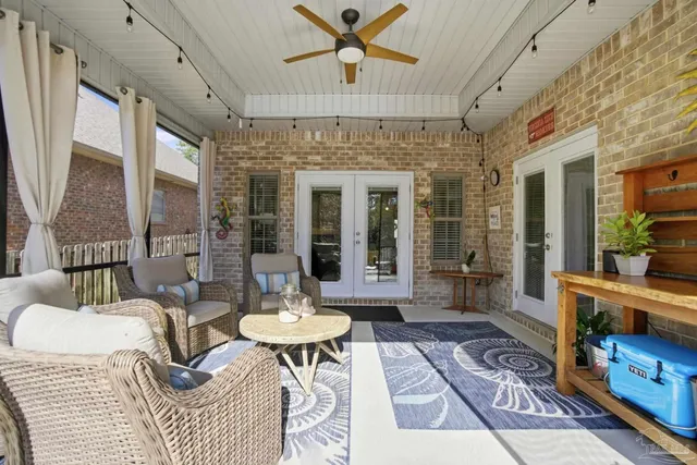 a view of backyard of house with seating space