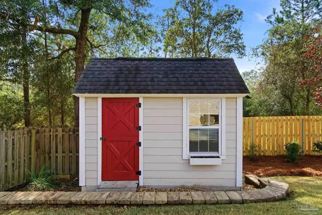 an aerial view of residential house with outdoor space and parking