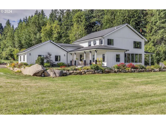 a aerial view of a house next to a big yard
