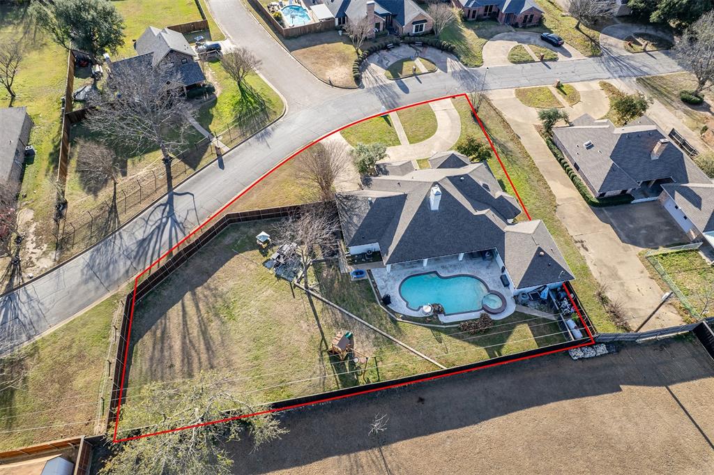 300 Rash Lane Terrell, TX 75160 - Photo 2 of 28 an aerial view of a house with a swimming pool