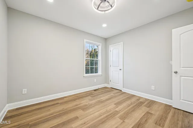 a view of a balcony with wooden floor