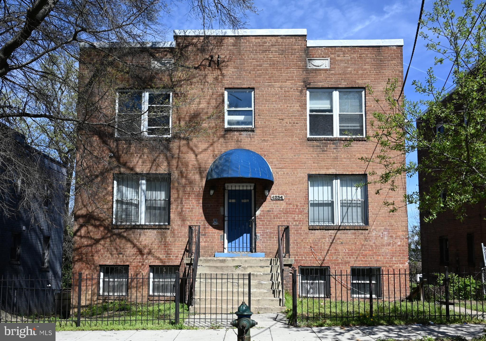 a front view of a house with yard