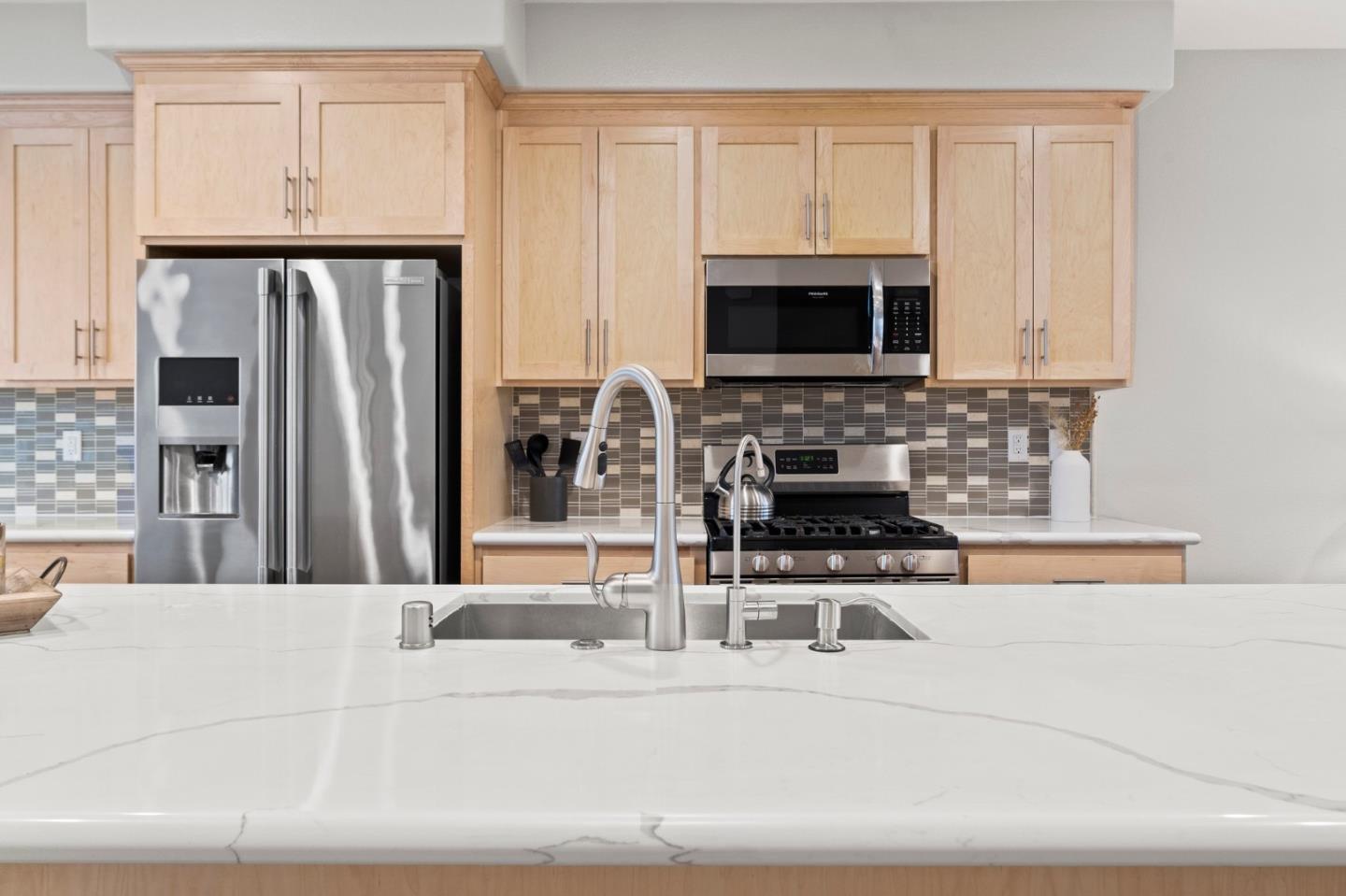 435 Montague Expressway Milpitas, CA 95035 - Photo 12 of 46 a kitchen with stainless steel appliances a stove a microwave and a refrigerator