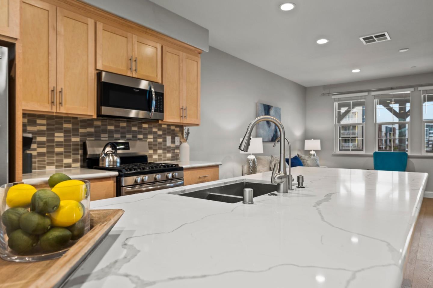 435 Montague Expressway Milpitas, CA 95035 - Photo 13 of 46 a kitchen with stainless steel appliances granite countertop a sink a stove and a microwave with granite countertops