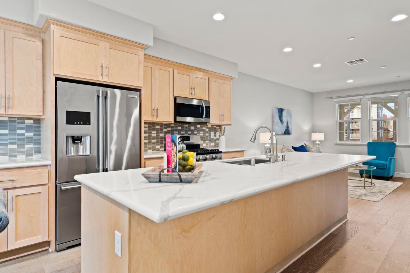 435 Montague Expressway Milpitas, CA 95035 - Photo 16 of 46 a kitchen with sink a refrigerator and chairs