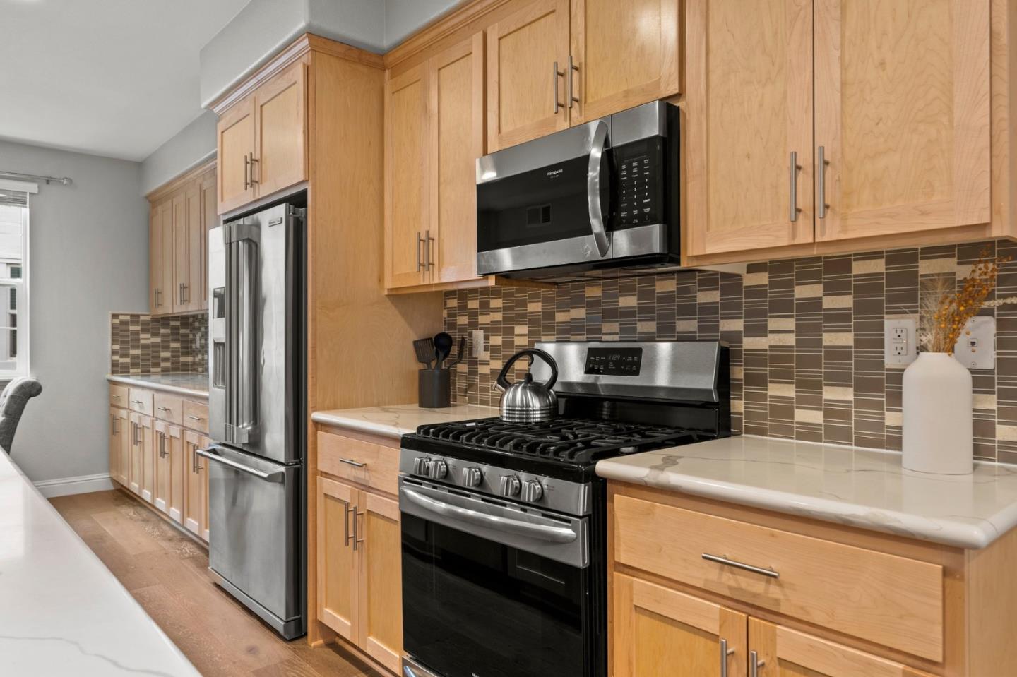 435 Montague Expressway Milpitas, CA 95035 - Photo 17 of 46 a kitchen with stainless steel appliances granite countertop a stove microwave refrigerator and sink