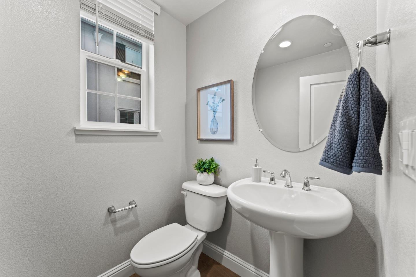 435 Montague Expressway Milpitas, CA 95035 - Photo 19 of 46 a bathroom with a sink mirror and toilet