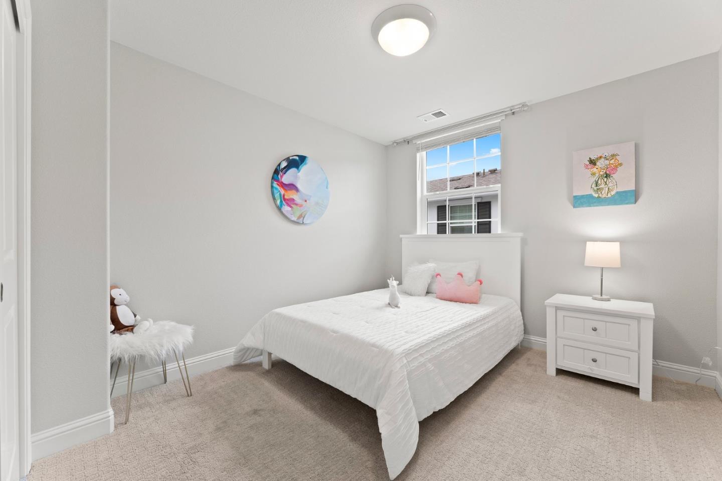 435 Montague Expressway Milpitas, CA 95035 - Photo 24 of 46 a bedroom with a bed and a painting on the wall