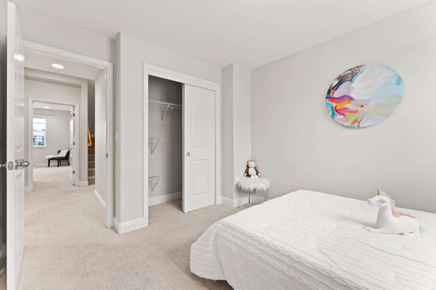 435 Montague Expressway Milpitas, CA 95035 - Photo 27 of 46 a bedroom with a bed and a painting on the wall