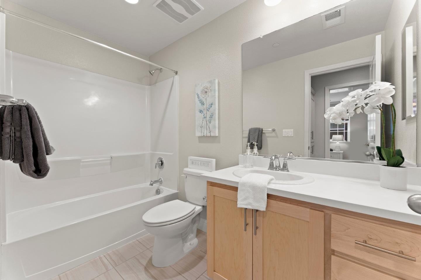 435 Montague Expressway Milpitas, CA 95035 - Photo 32 of 46 a bathroom with a sink a toilet and shower