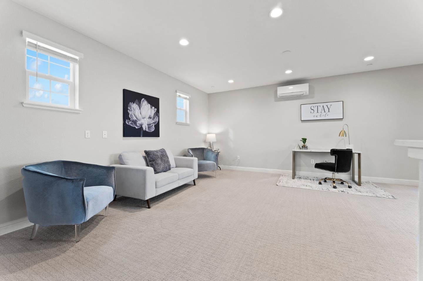 435 Montague Expressway Milpitas, CA 95035 - Photo 33 of 46 a living room with furniture and a chair