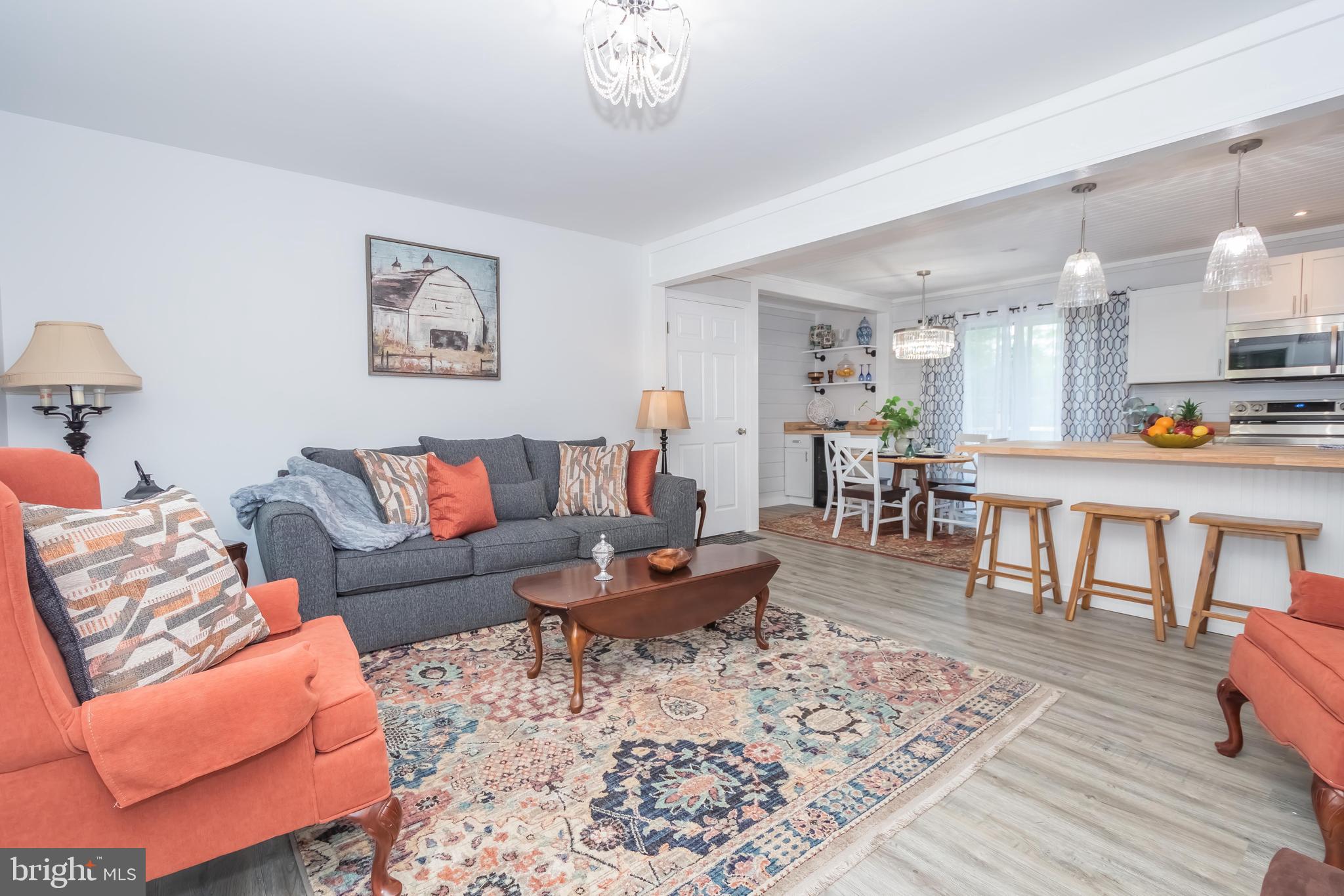 4211 Chestnut Ridge Road Grantsville, MD 21536 - Photo 18 of 43 a living room with furniture and a dining table