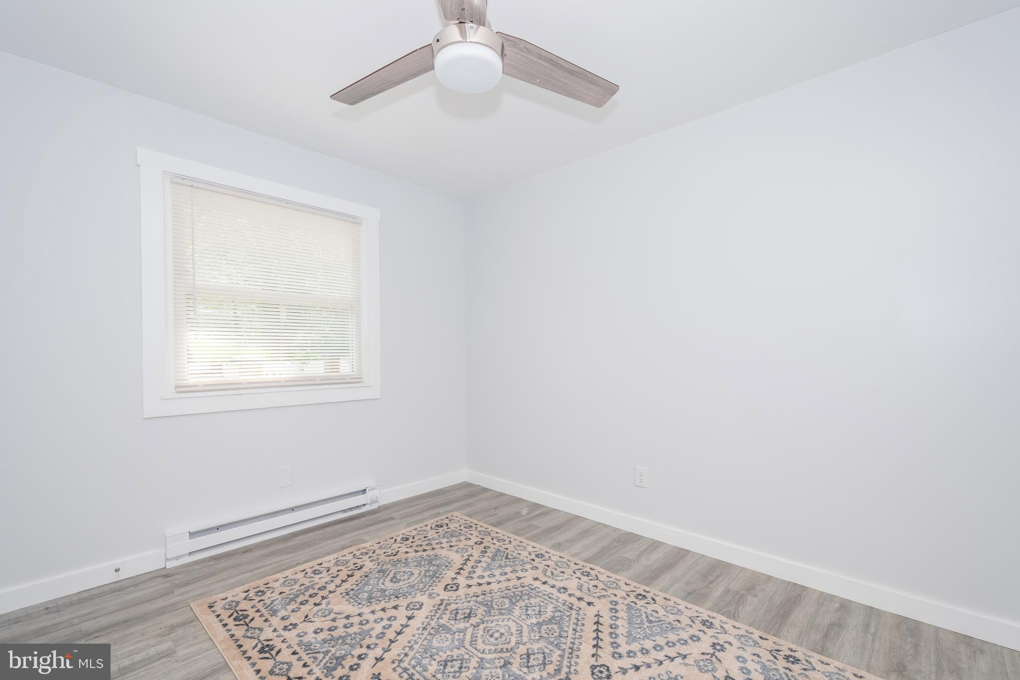 4211 Chestnut Ridge Road Grantsville, MD 21536 - Photo 22 of 43 an empty room with a window and ceiling fan