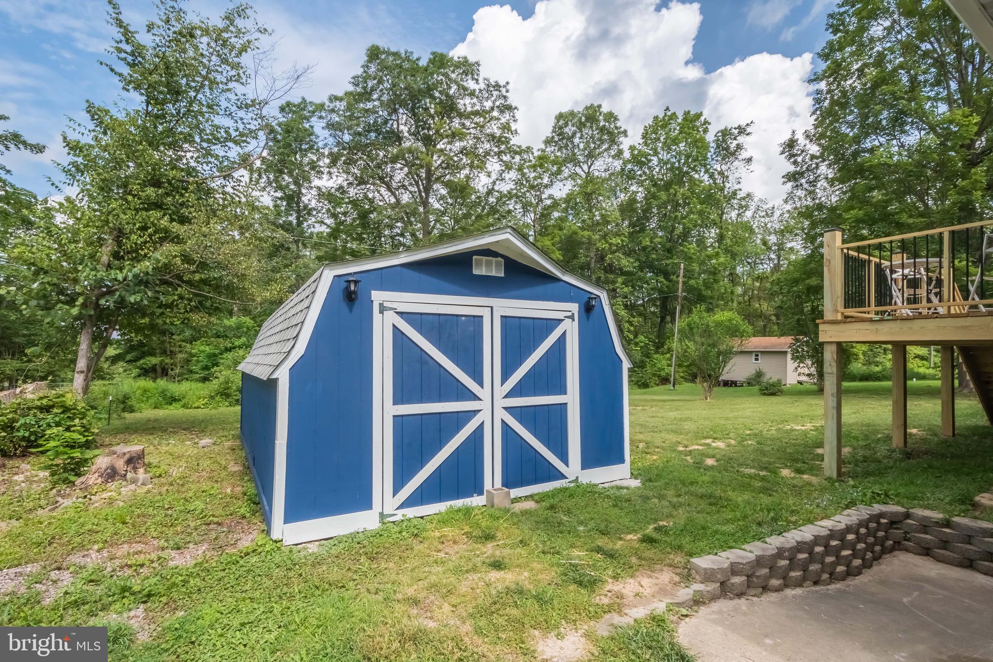 4211 Chestnut Ridge Road Grantsville, MD 21536 - Photo 10 of 43 a view of barn with a small yard and large trees