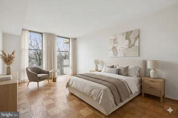 a bedroom with a bed and a couch