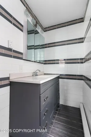 a kitchen with a sink and a refrigerator