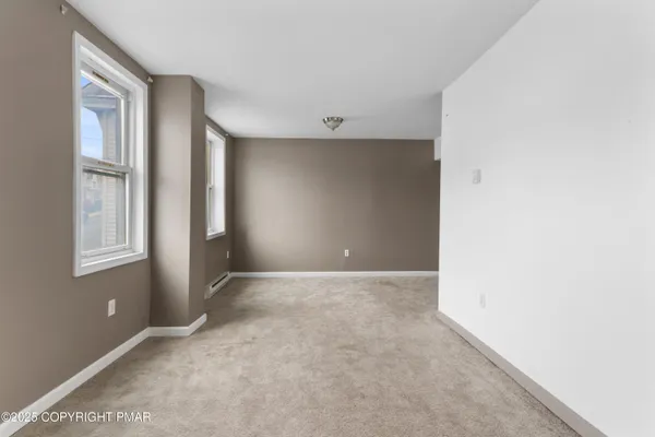 an empty room with windows