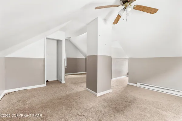 a view of a room with closet and fan
