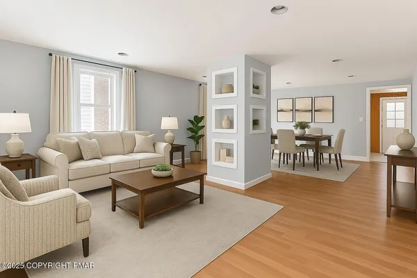 a living room with furniture and wooden floor