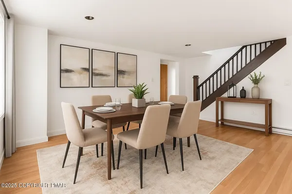 a view of a dining room with furniture window and wooden floor