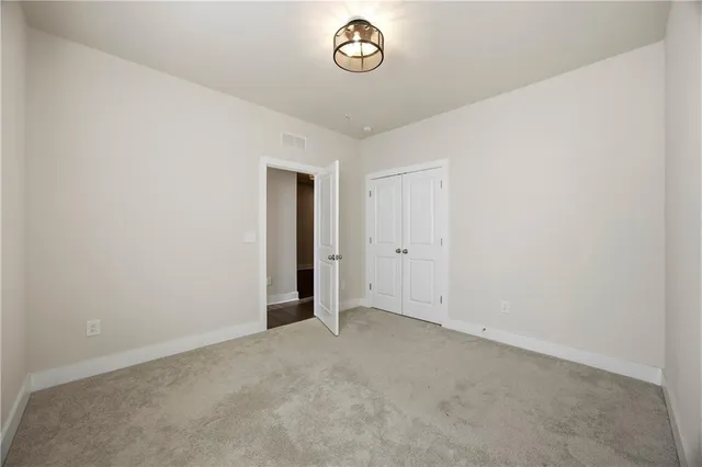 a bathroom with a sink toilet vanity and shower