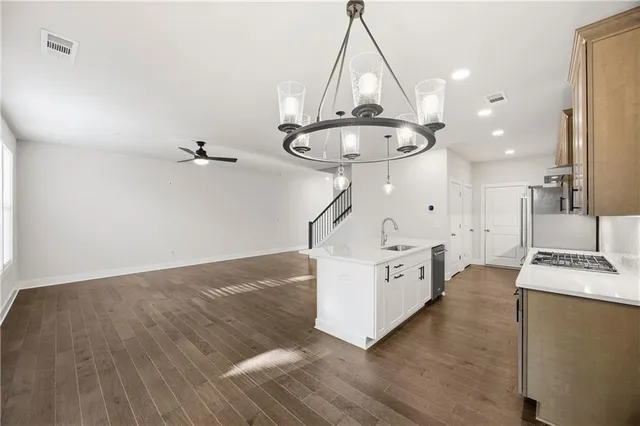 a view of kitchen with cabinets and wooden floor