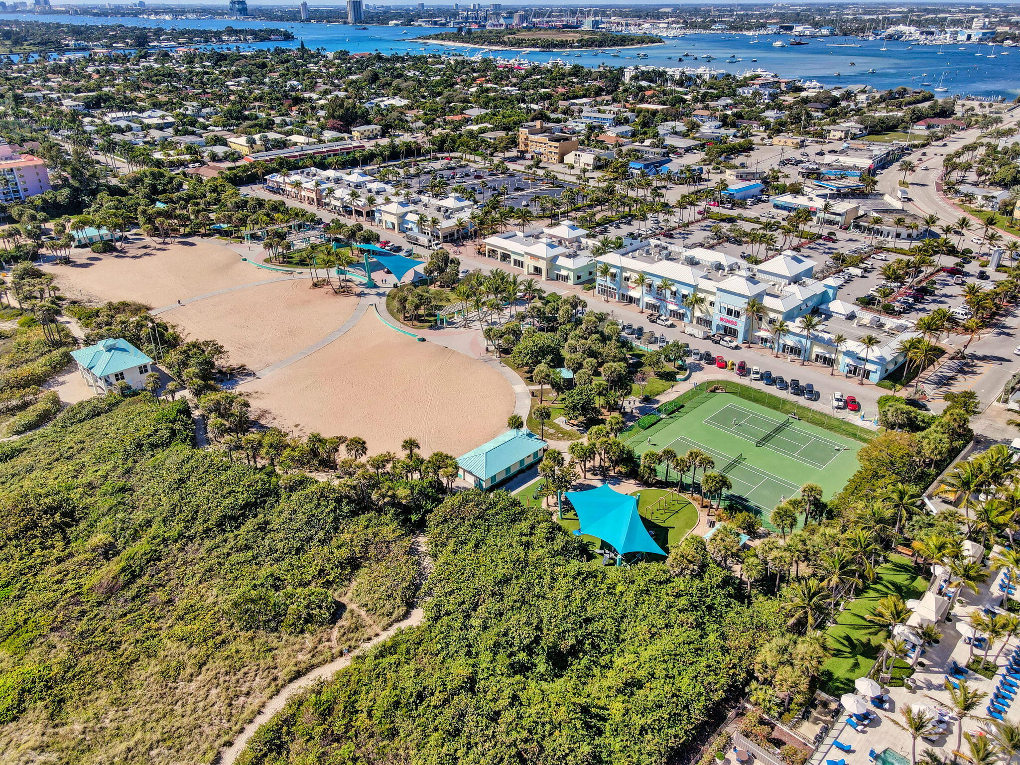 2700 North Ocean Drive, Unit 1401A Riviera Beach, FL 33404 - Photo 116 of 116 an aerial view of residential houses with outdoor space and trees