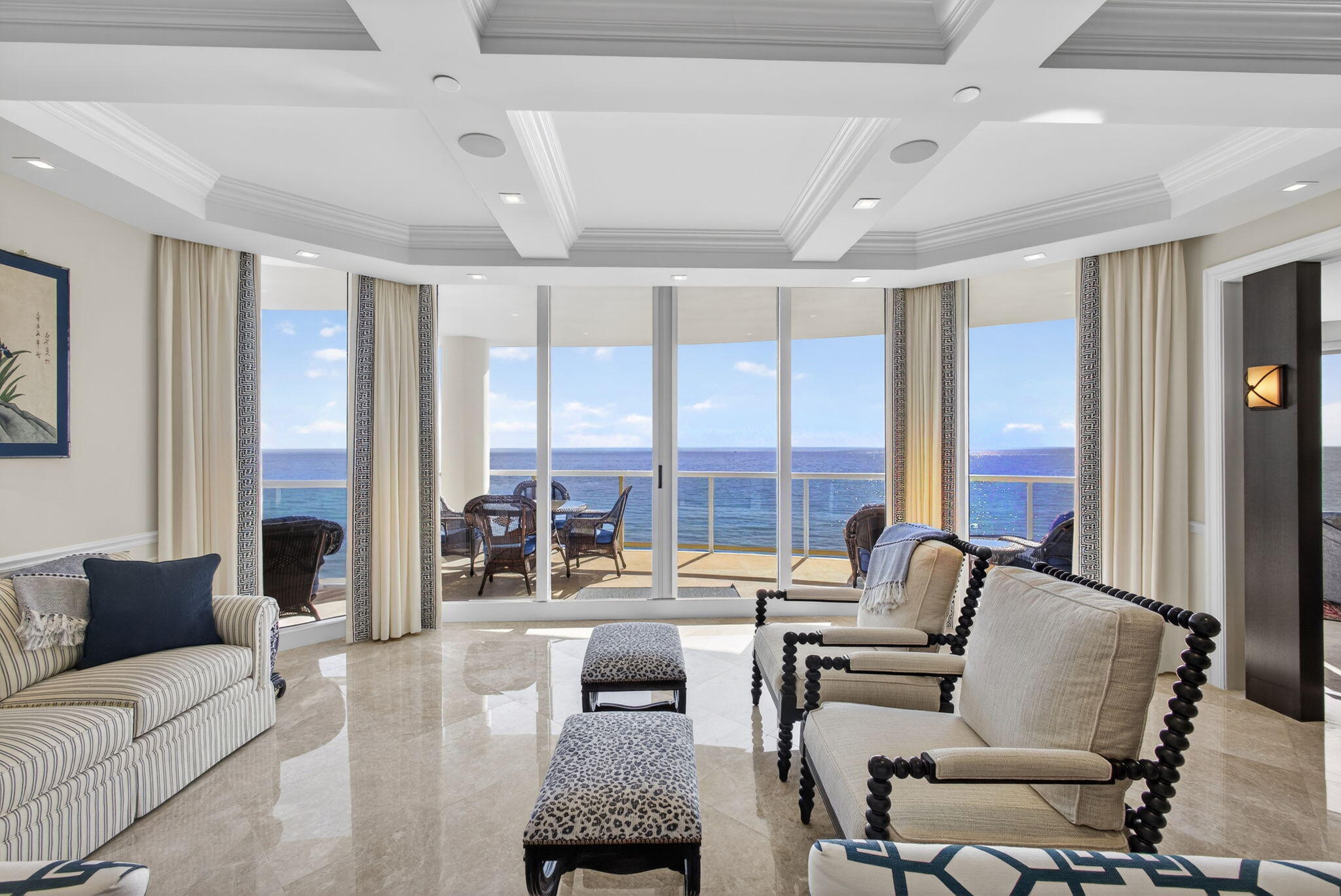 2700 North Ocean Drive, Unit 1401A Riviera Beach, FL 33404 - Photo 14 of 116 a living room with furniture and floor to ceiling windows
