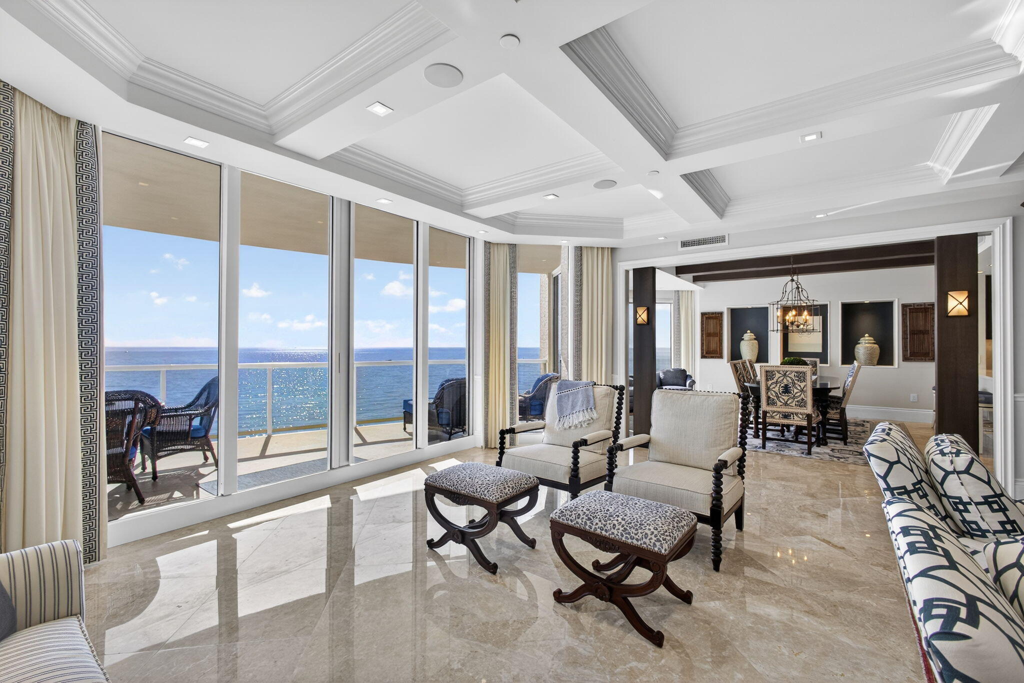 2700 North Ocean Drive, Unit 1401A Riviera Beach, FL 33404 - Photo 16 of 116 a living room with furniture and floor to ceiling windows