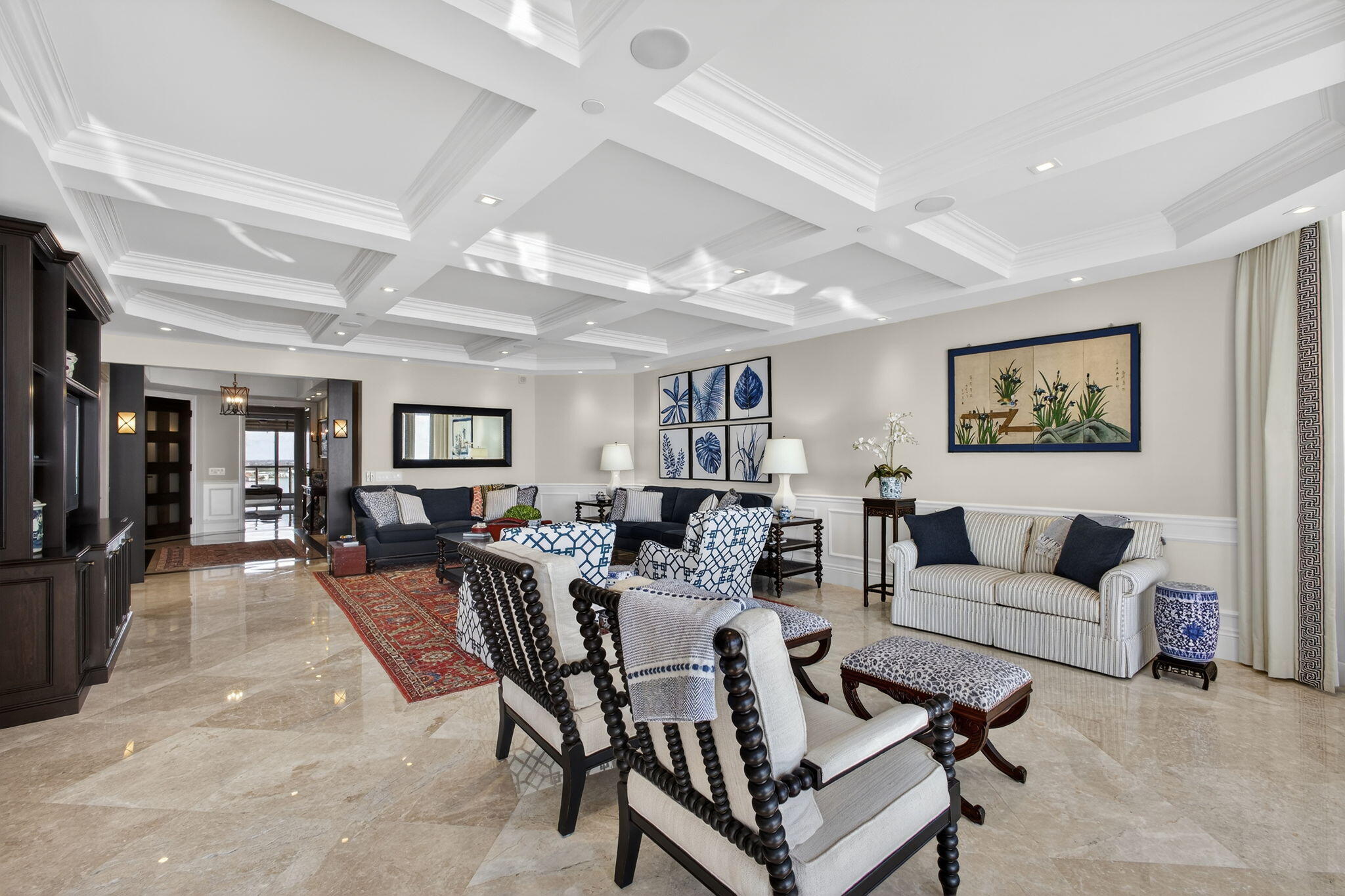2700 North Ocean Drive, Unit 1401A Riviera Beach, FL 33404 - Photo 18 of 116 a living room with furniture and a flat screen tv