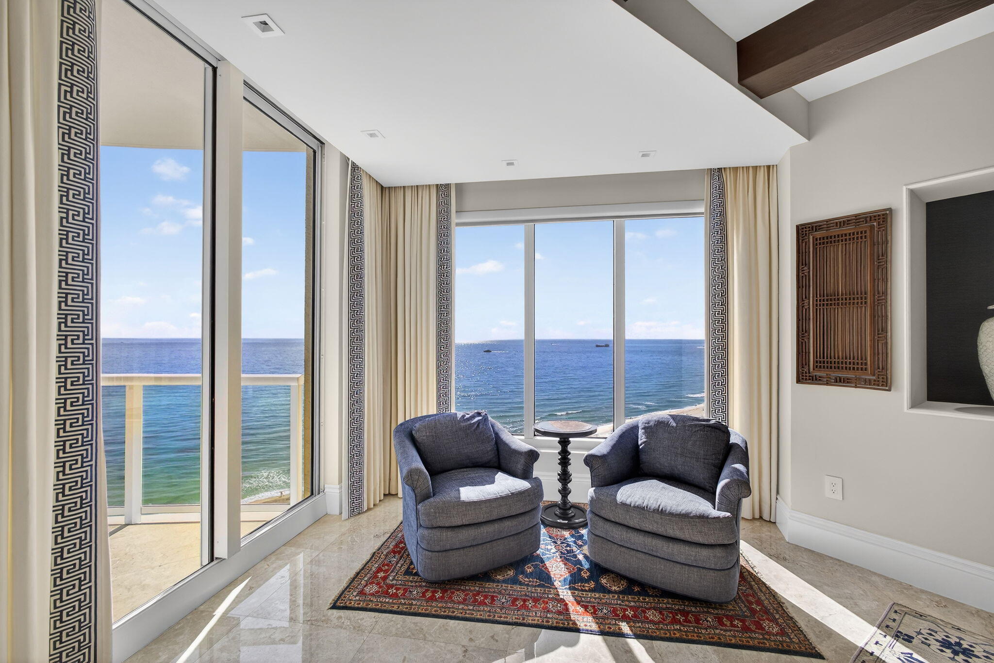 2700 North Ocean Drive, Unit 1401A Riviera Beach, FL 33404 - Photo 25 of 116 a living room with furniture and a large window