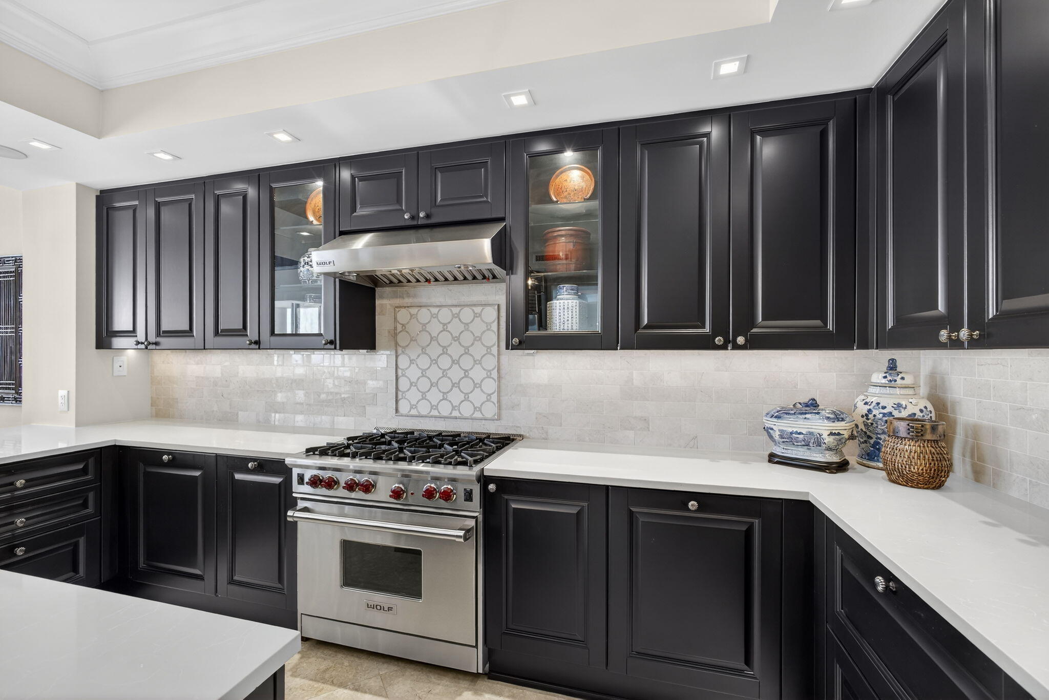2700 North Ocean Drive, Unit 1401A Riviera Beach, FL 33404 - Photo 33 of 116 a kitchen with stainless steel appliances a sink stove and cabinets
