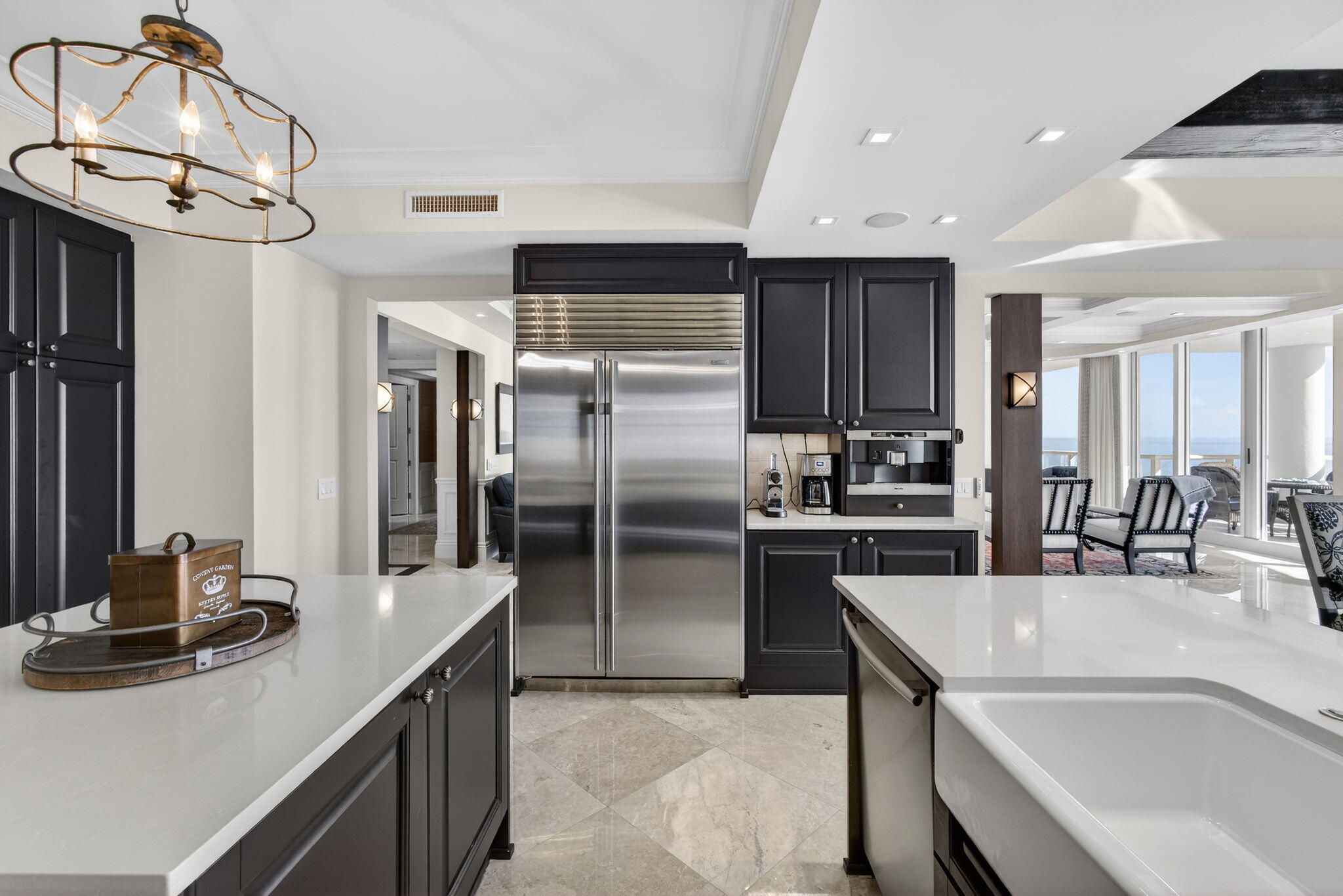 2700 North Ocean Drive, Unit 1401A Riviera Beach, FL 33404 - Photo 35 of 116 a kitchen with stainless steel appliances granite countertop a sink a stove and a refrigerator