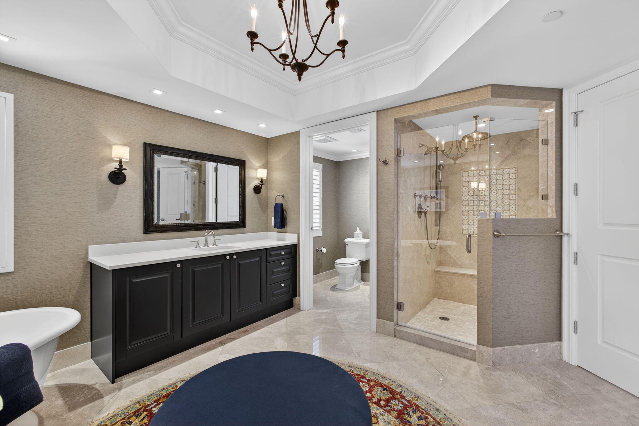 2700 North Ocean Drive, Unit 1401A Riviera Beach, FL 33404 - Photo 46 of 116 a spacious bathroom with a shower a sink and a mirror