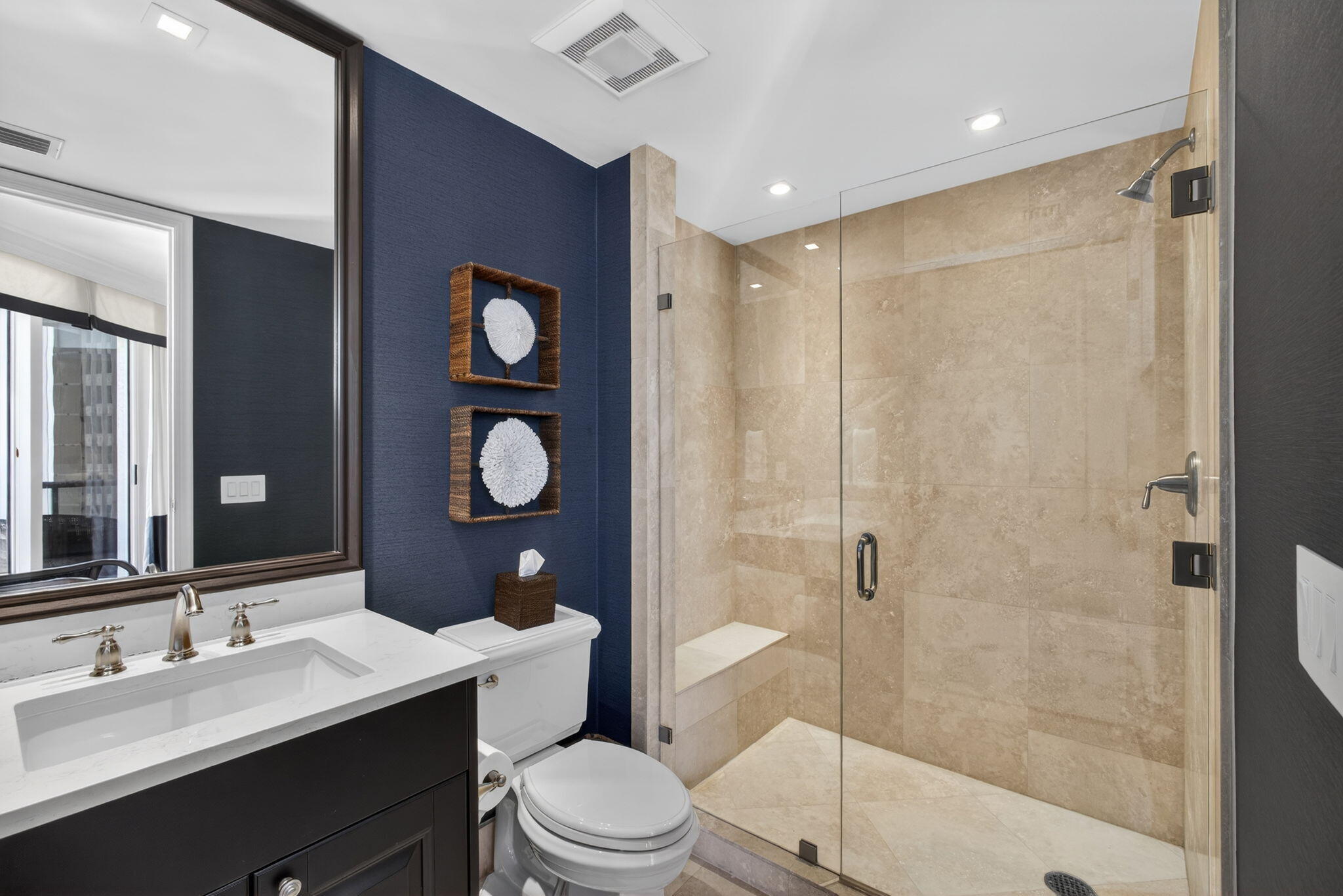 2700 North Ocean Drive, Unit 1401A Riviera Beach, FL 33404 - Photo 51 of 116 a bathroom with a toilet a sink and a large mirror