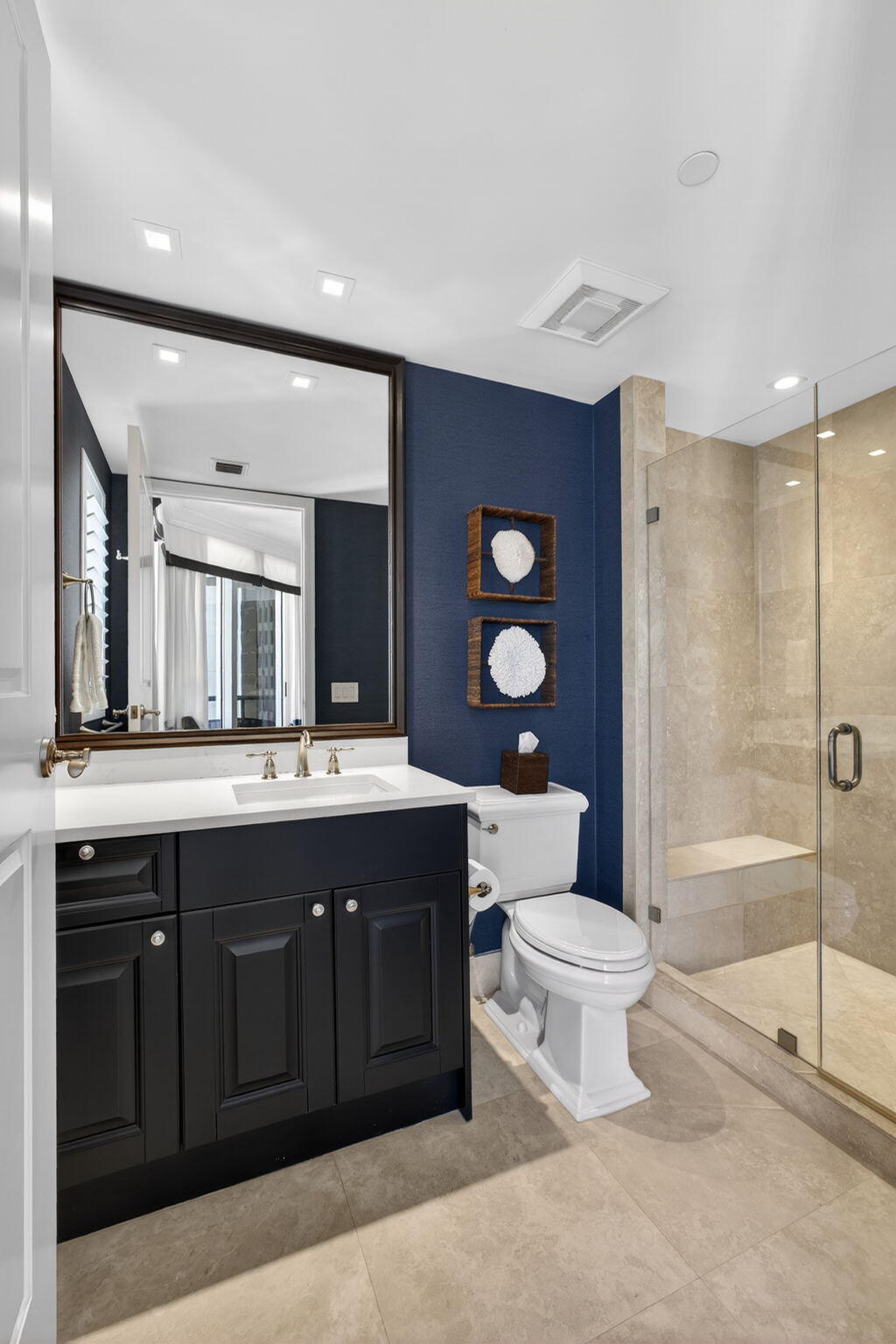2700 North Ocean Drive, Unit 1401A Riviera Beach, FL 33404 - Photo 53 of 116 a bathroom with a double vanity sink mirror and toilet