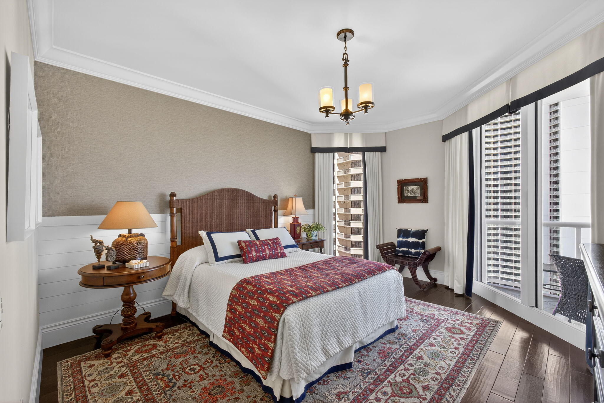 2700 North Ocean Drive, Unit 1401A Riviera Beach, FL 33404 - Photo 55 of 116 a bed room with a bed and a chandelier