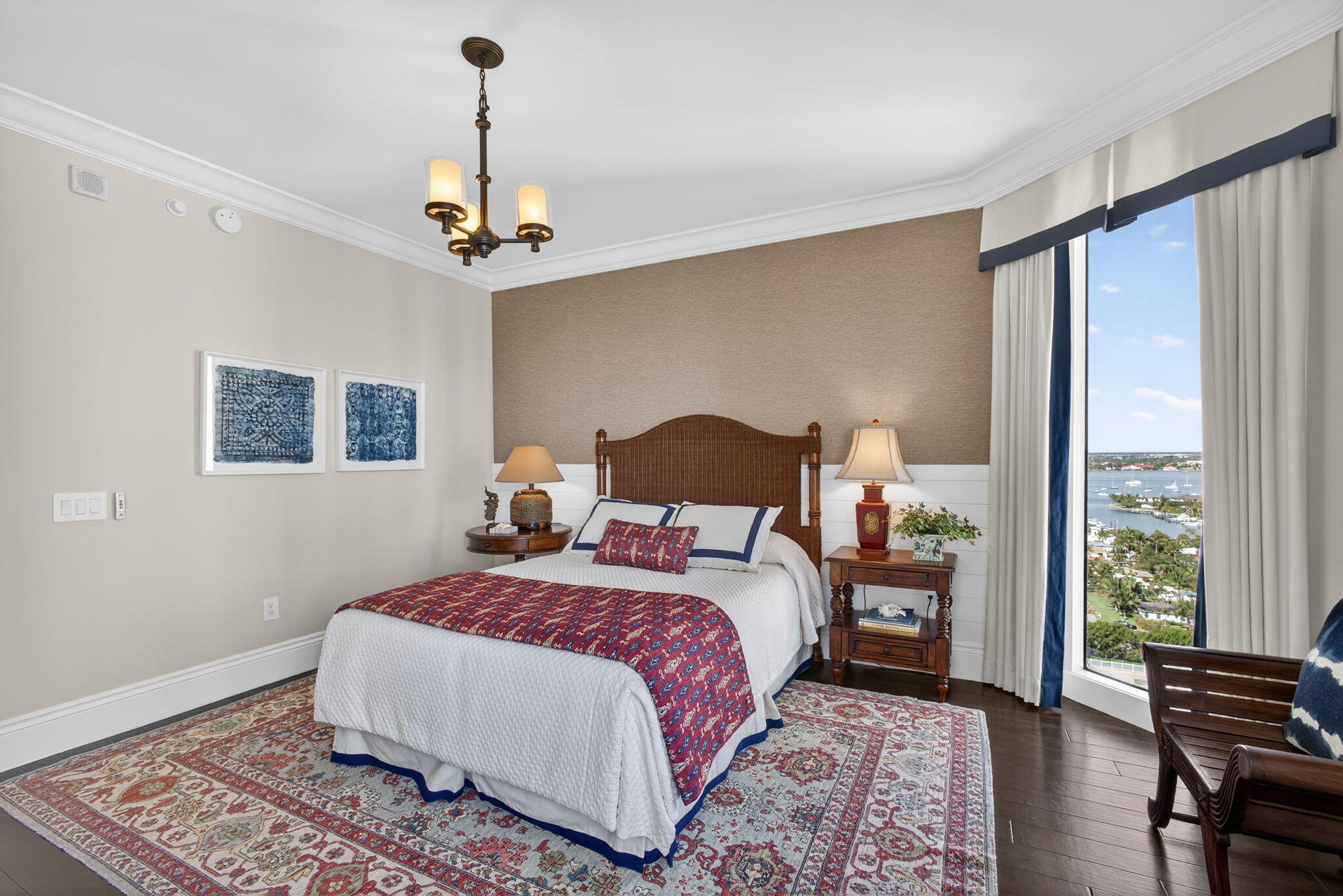 2700 North Ocean Drive, Unit 1401A Riviera Beach, FL 33404 - Photo 56 of 116 a bedroom with a bed lamp and a window