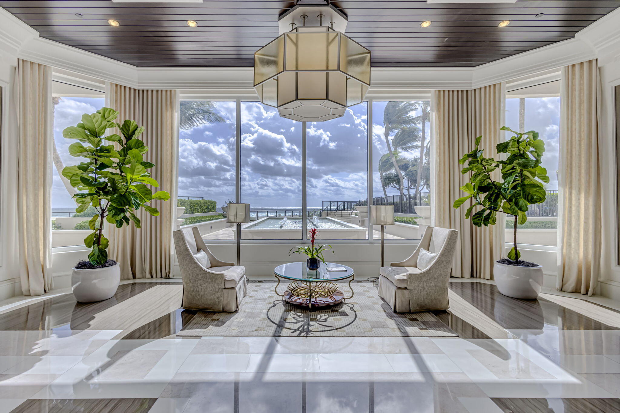2700 North Ocean Drive, Unit 1401A Riviera Beach, FL 33404 - Photo 87 of 116 a living room with patio furniture and a potted plant