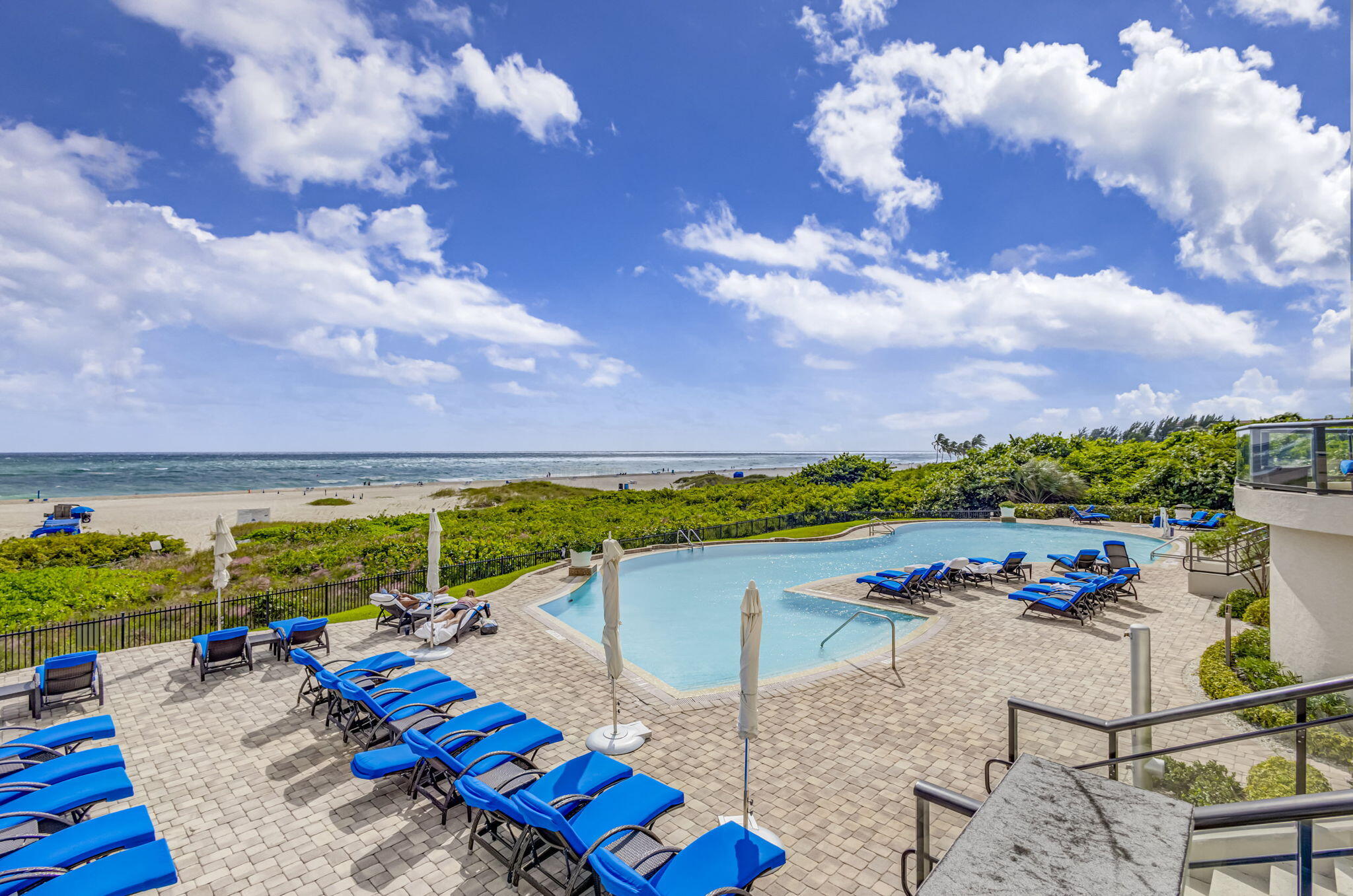 2700 North Ocean Drive, Unit 1401A Riviera Beach, FL 33404 - Photo 90 of 116 a view of swimming pool with outdoor seating and mountain view in back