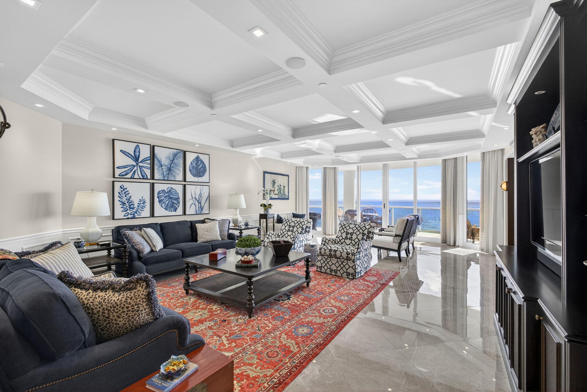 2700 North Ocean Drive, Unit 1401A Riviera Beach, FL 33404 - Photo 10 of 116 a living room with furniture large window and a flat screen tv