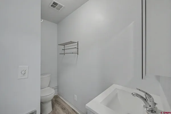 a bathroom with a sink and toilet