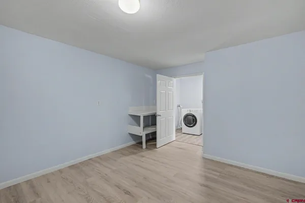 a view of a livingroom with wooden floor