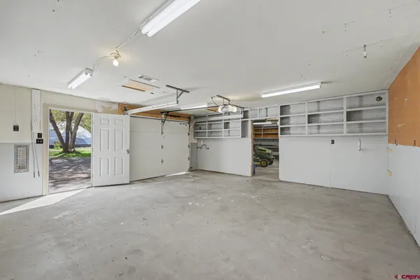 a view of a kitchen with a refrigerator and a cabinets