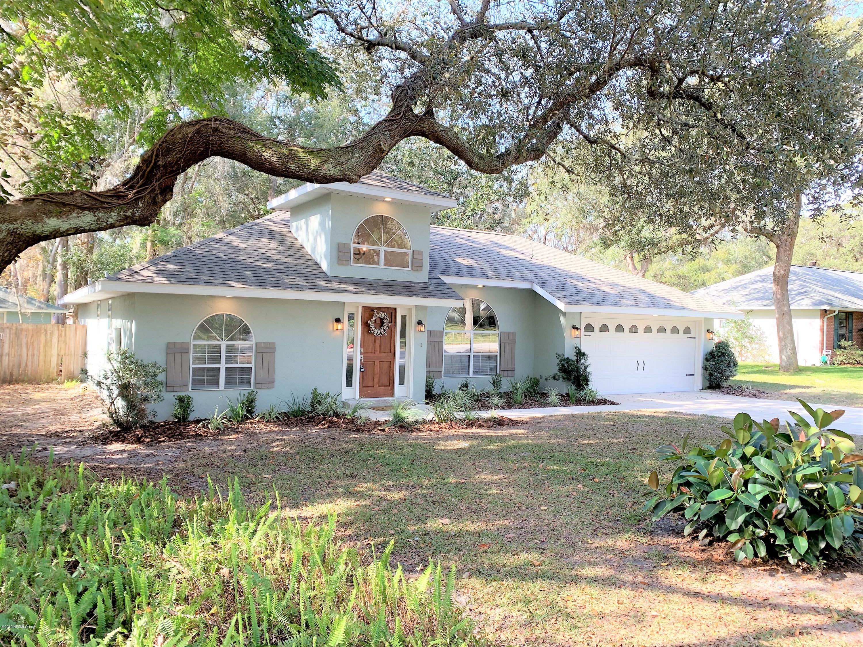3300 Turtle Creek Road St. Augustine, FL 32086 - Photo 1 of 35 a front view of a house with a garden